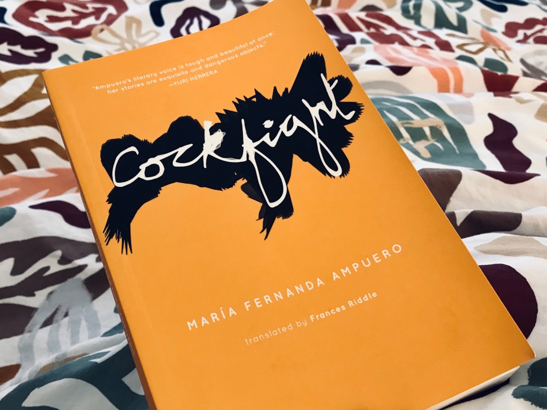 cockfight book yellow cover against blanket floral